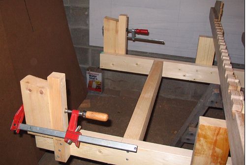 Transom uprights in two parts, clamped together for adjustment